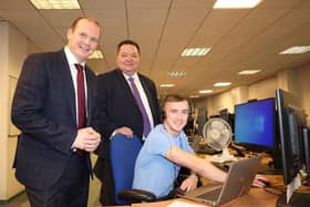 Communities Minister Gordon Lyons and Department for Work and Pensions Minister Andrew Western meet staff during a visit to the service centre in the Great Northern Tower, Belfast. CREDIT DFC