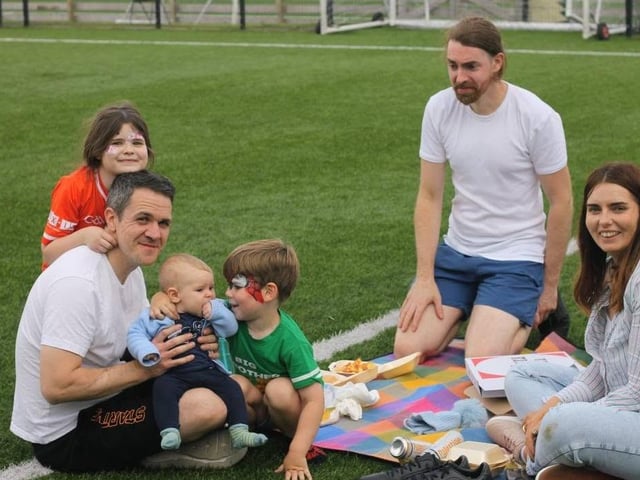 Having a family picnic at the Lurgan Against Racism 5-a-side tournament and fun day in Knockramer Park.