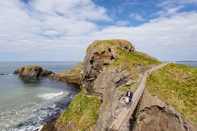 The Carrick-a-Rede Rope Bridge is located near Ballintoy, Co Antrim, spanning over the space of 20 metres.
Walk 30 metres in the air with a view of the rocks down below and pose for some great photos that you can upload later.