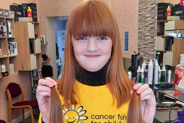 Portadown girl Lily-Grace Millar (9) who had her hair cut  to donate to The Little Princess Trust whilst raising money for Cancer Fund for Children.