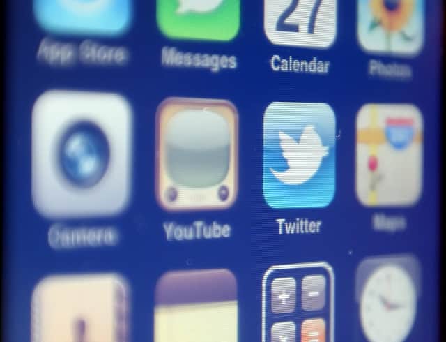 The logo of social networking website Twitter is seen displayed on the screen of an iPhone smartphone.