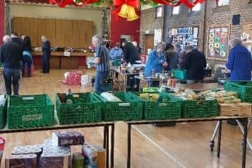 Volunteers helping to prepare Christmas hampers at Larne Foodbank. Photo submitted by Larne Foodbank