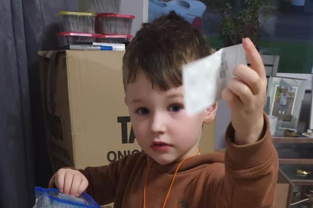 David's grandson Levi has been helping his granda prepare packs of water purification tablets.