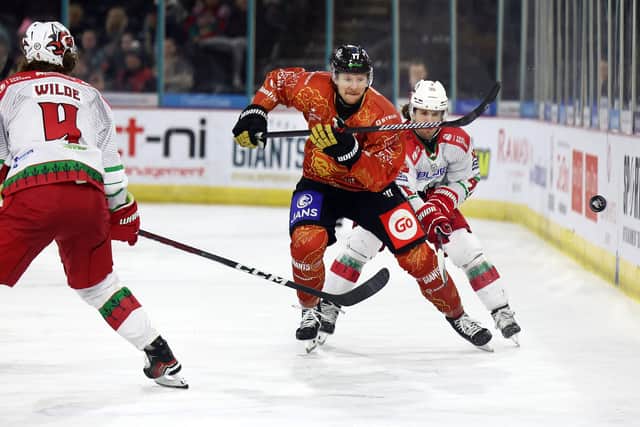 Belfast Giants’ Oliver Cooper with Cardiff Devils’ Cole Sanford during Sunday’s EIHL game at the SSE Arena, Belfast.   Photo by William Cherry/Presseye