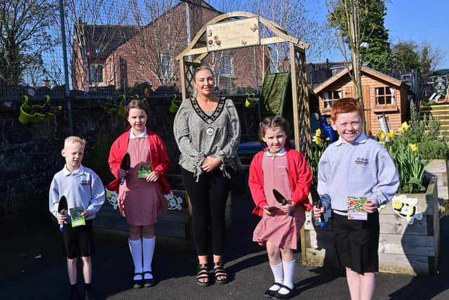 Cllr Leah Smyth pictured with pupils from Parkgate Primary School who received their seeds and trowels.