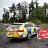 Police at the scene of the Aughnacloy road crash, which claimed the lives of three people from the Strabane area.