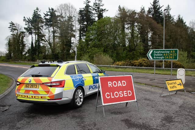 Police at the scene of the Aughnacloy road crash, which claimed the lives of three people from the Strabane area.