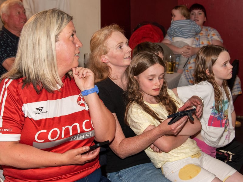Fans watch intently as local swimmer Daniel Wiffen competes in the Olympic 1500m Freestyle final on Sunday evening. LM32-211.