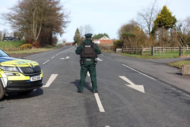 Police on the Curr Road, between Omagh and Ballygawley, following a crash between a BMW and a lorry on Tuesday evening which claimed the life of 30-year-old Caolan Devlin. Picture: Pacemaker