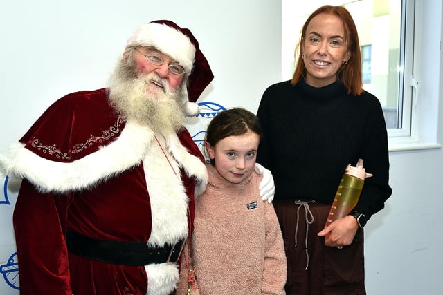 Ruby Cullen (9) and mum, Nicola pictured with Santa during his joint visit to the Blossom Unit with Lord Mayor of ABC Council, Alderman Margaret Tinsley  on Christmas Eve.