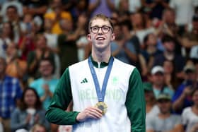 Gold medalist Daniel Wiffen of Team Ireland poses on the podium during the swimming medal ceremony after the men's 800m Freestyle Final at La Defense Arena in Paris on July 30. (Photo by Adam Pretty/Getty Images).