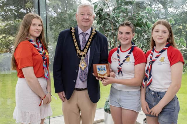Mayor of Causeway Coast and Glens Borough Council, Councillor Steven Callaghan congratulates Amelie Holden and Celia Kerr from local Castlerock Scout Group and Girl Guides leader Hannah Ruth Mullan, as they all prepare for attendance at the 25th World Scout Jamboree in South Korea this August. Credit McAuley Multimedia