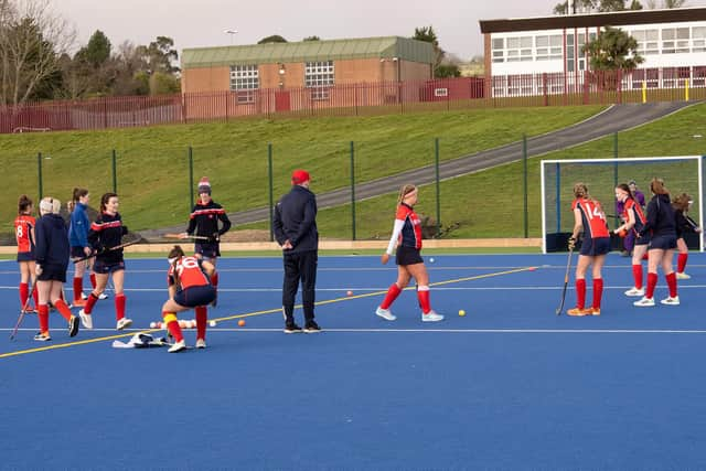 Carrick Castle 1st XI  warming up at the new pitch.