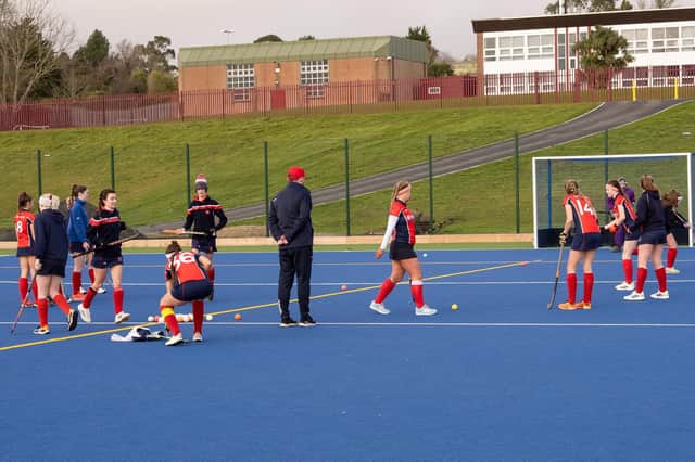 Carrick Castle 1st XI  warming up at the new pitch.