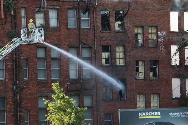 Firefighters attending to a large fire at a building in Samuel Street in Belfast city centre this morning. Photo by Press Eye. Photo: Kelvin Boyes