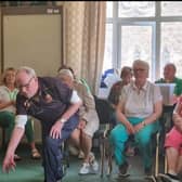 President of Portrush Bowling Club, Uel McCloy giving some coaching to members of the Portrush REACH charity. Credit Donna McCloy