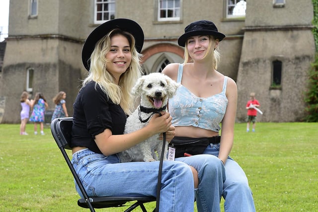 Andrea and Denisa Albeanu with dog, Dixie. Pic credit: Lisburn and Castlereagh City Council