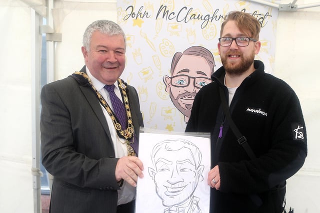 John McClaughrey, artist, presents Mayor Ivor Wallace with a portrait  during the Ballymoney Spring Fair on Saturday