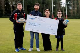 Power NI's Barry Rogan (second from left) pictured with Newforge Taggers Tag RFC representatives