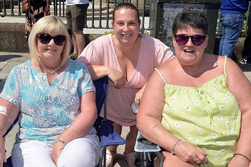 Sitting in a great viewing spot for Sunday's youth parade are from left, Barbara Liggett, Jane Green and Kim ANderson. PT23-247.