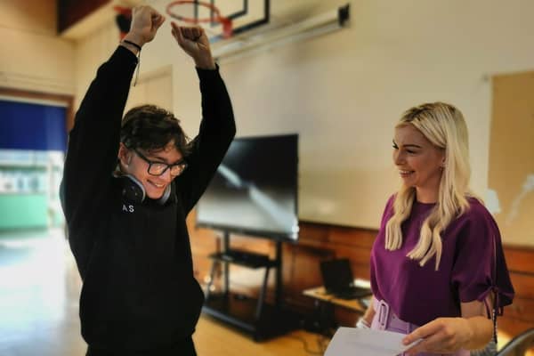 St John the Baptist's College pupil Anthony De Sousa pictured in delight with his form teacher Miss Marian Barker as he receives his GCSE results.