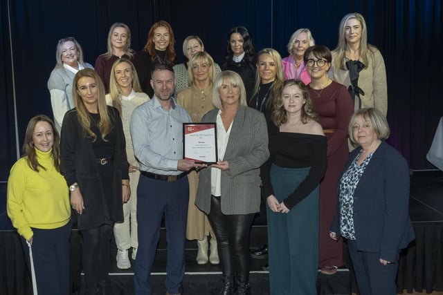 Brendan Patterson Project Manager, Focus on Families, pictured with the Hair and Beauty team, winner of the Good for ME, Good for FE award.