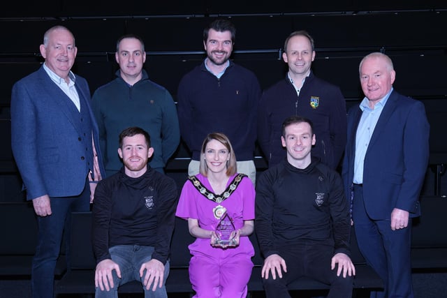 Representatives from Ulster Club football champions Watty Grahams Glen, receive their award from Chair of the Council, Councillor Córa Corry with nominating councillors Sean McPeake and Brian McGuigan.