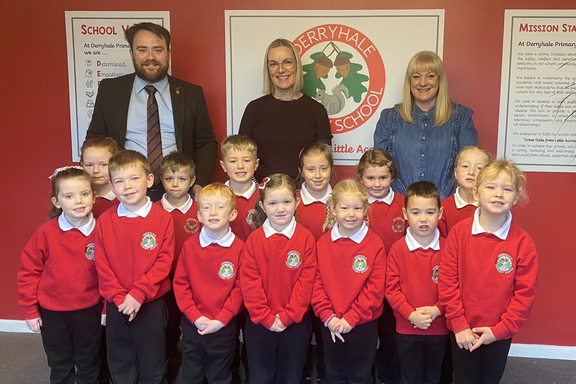The new P1 class at Derryhale Primary School with Mr Glenny (principal), Mrs McCallen (teacher) and Mrs Vennard (classroom assistant).