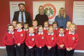 The new P1 class at Derryhale Primary School with Mr Glenny (principal), Mrs McCallen (teacher) and Mrs Vennard (classroom assistant).
