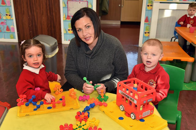 Enjoying playtime at Kids United Playgroup are pupils, Ella-Rose and Charlie with playgroup assistant Emma Dowd. PT99-222.