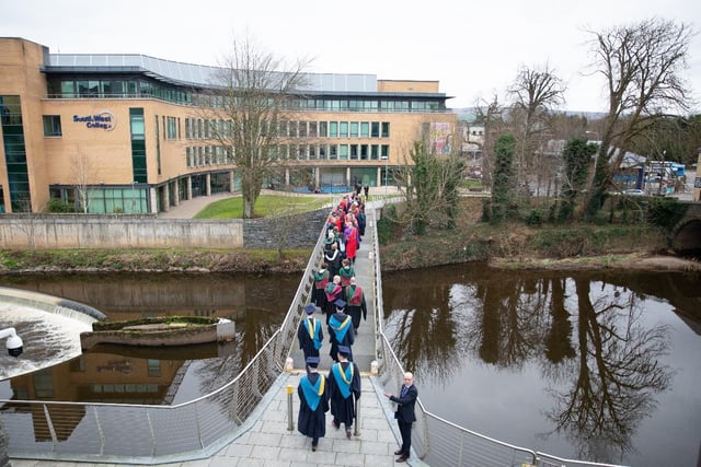 South West College (SWC) Principal and Chief Executive, Celine McCartan leads members of the Platform Party and graduates back to South West College Omagh campus, following two successful ceremonies on Friday 3 March 2023.