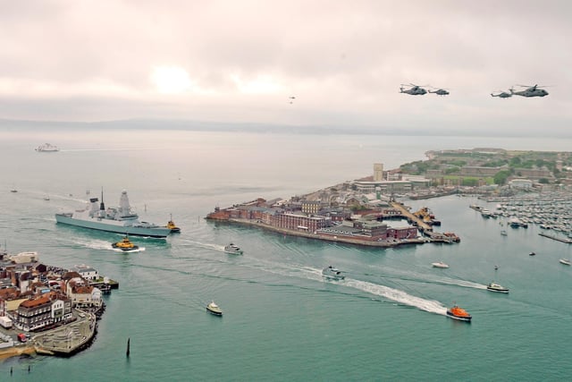 HMS Diamond enters Portsmouth Harbour and Portsmouth Naval Base to launch Her Majesty The Queen Diamond Jubilee Weekend of Celebrations 
As HMS Diamond approached she fired her guns to salute the Naval War Memorial on Southsea seafront and Fort Blockhouse at Gosport fired a 21 gun salute as four helicopters and a Typhoon jet flew above 
Picture: Malcolm Wells (121823-6239)