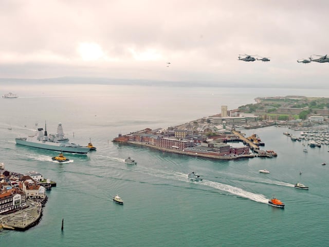 HMS Diamond enters Portsmouth Harbour and Portsmouth Naval Base to launch Her Majesty The Queen Diamond Jubilee Weekend of Celebrations 
As HMS Diamond approached she fired her guns to salute the Naval War Memorial on Southsea seafront and Fort Blockhouse at Gosport fired a 21 gun salute as four helicopters and a Typhoon jet flew above 
Picture: Malcolm Wells (121823-6239)