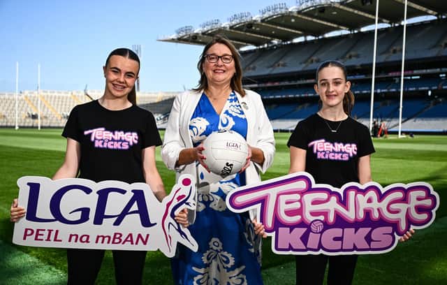 Ladies Gaelic Football Association President Trina Murray, centre, with Whitehall U14 ladies footballers Emma Thorp, left, and Aisling Noonan pictured at Croke Park as the LGFA launches its new ‘Teenage kicks’ app. Pic: Ben McShane/Sportsfile