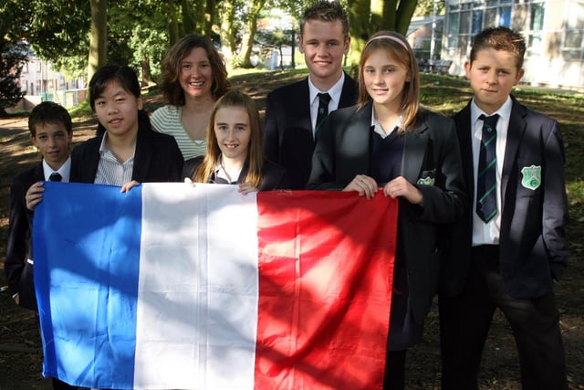 Fort Hill College language teacher Mrs Alton with a group of year 10 pupils who visited Hilden Integrated Primary School as part of the celebrations to mark European Day of Languages in 2006