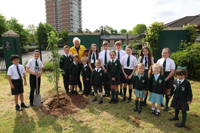 Lady Mary Peters with pupils from Finaghy Primary School