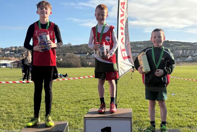 (L-R): Ben Dumigan, Towerview Primary School (2nd), Oliver Mitchell, Dundonald Primary School (1st), and Jacob Castles, Dundonald Primary School (3rd) at the third round of the 2024-2025 Flahavan’s Athletics NI Primary School Cross Country League at Dunleath Playing Fields.