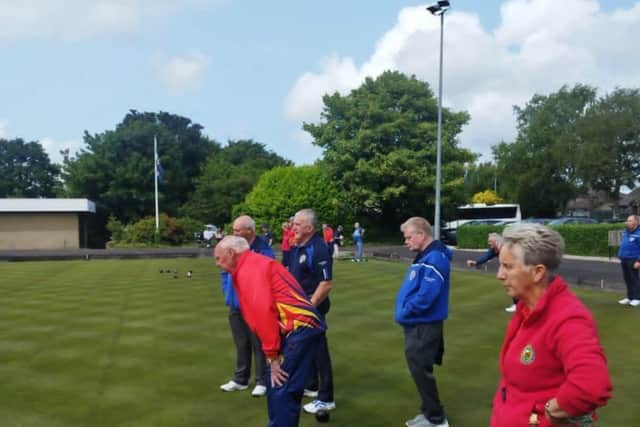 Wilfie McCullough studies the bowl approaching the head during Irish Junior Cup match at Brookgreen last Saturday