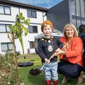 Ald Ross pictured with Carol McTaggart and Noah Mulvenna.