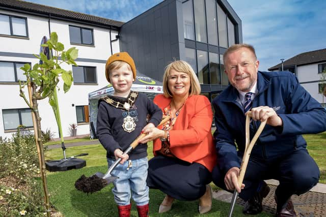 Ald Ross pictured with Carol McTaggart and Noah Mulvenna.