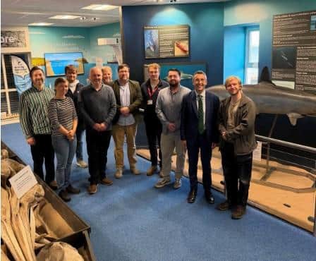 DAERA Minister Andrew Muir recently pictured at Portrush Costal Zone with organisations including Queen's University, Ulster Wildlife and the NI Marine Taskforce.