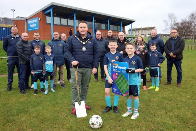 Antrim and Newtownabbey Mayor Cllr Mark Cooper BEM at the sod-cutting of the new 3G pitch in Monkstown. Pic: Antrim and Newtownabbey Borough Council