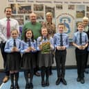 Waringstown Primary School pupils, principal and vice-principal with Carla Lockhart MP and volunteers of Well Kept Waringstown.