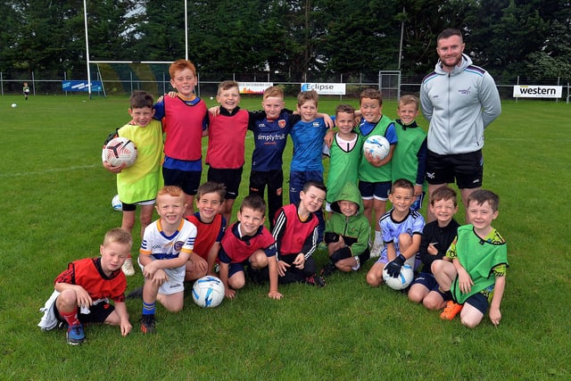 Boys who took part in a soccer skills session at Healthy Kidz Summer Camp. Also included is Healthy Kidz coach Conor Larkin. PT31-215.