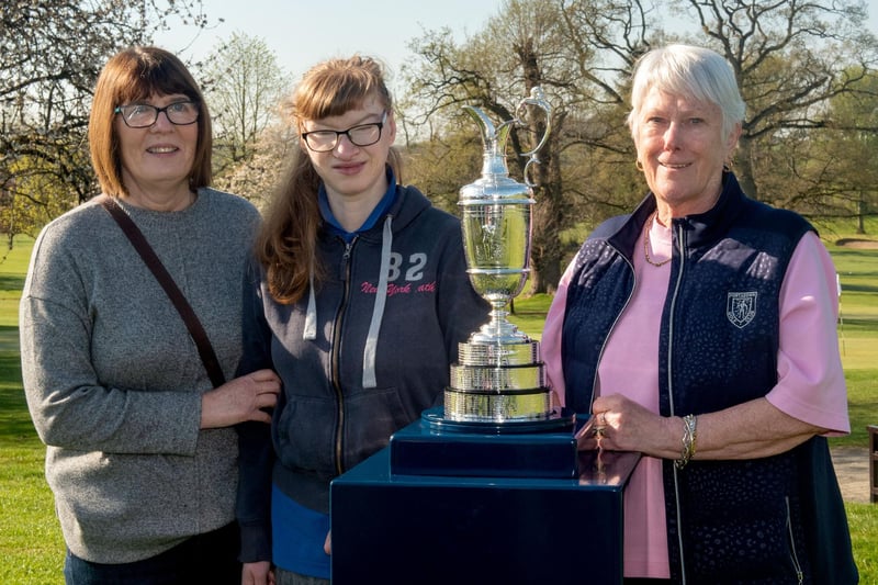 Looking happy with the famous Claret Jug are from left, Jacqui Connery, Jill Connery and Sandra Sandford, past lady captain. PT14-298.