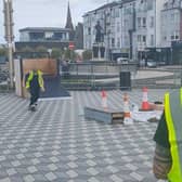 Slaine Browne (on the skateboard) with Dr Jim Donaghey (back to the camera) working on the ramps at Station Square in Portrush. Photo credit Wesley McMullen.