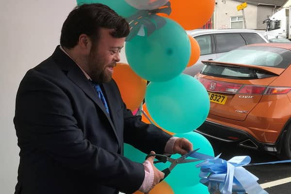 Oscar winning actor James Martin cuts the ribbon to mark the official opening of Fairhill Court in Maghera. Credit: NHSCT