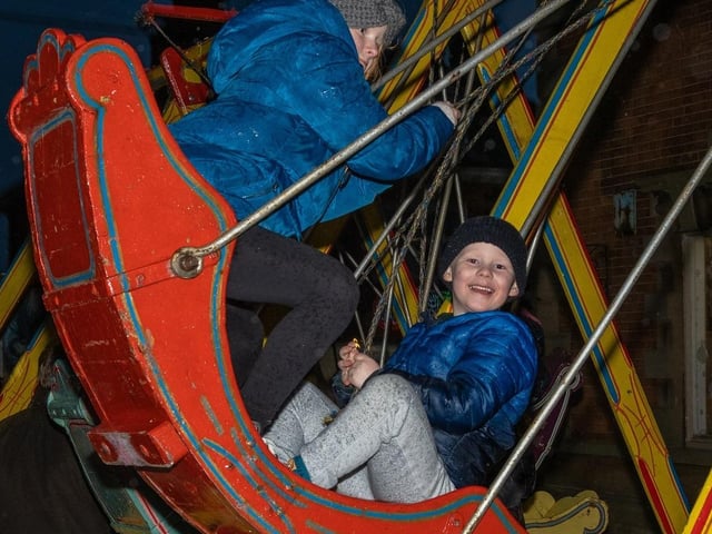 All smiles on the swingboats.