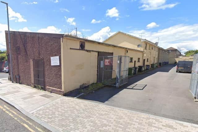 This low-level warehouse-type building, next to residential properties, will be knocked down to make way for five dwellings. Credit: Google