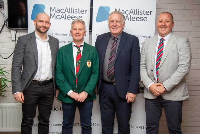 Former Northern Ireland international footballer Gerry Armstrong with club members at Larne RFC's annual dinner.